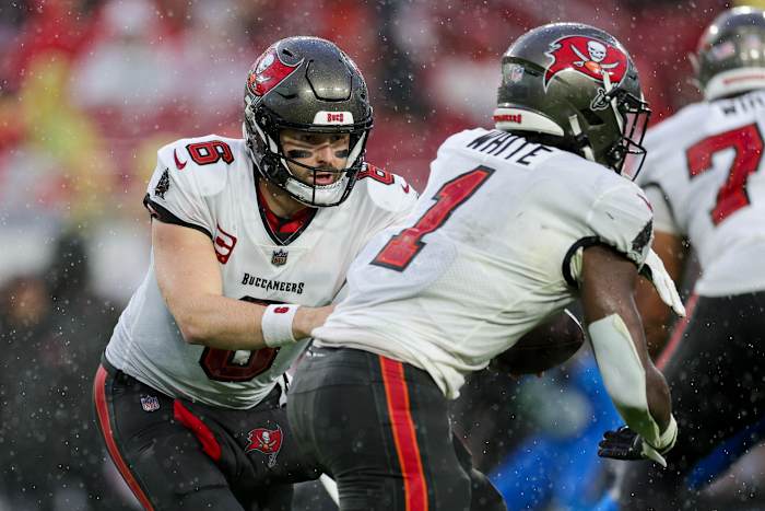 Dec 3, 2023; Tampa, Florida, USA; Tampa Bay Buccaneers quarterback Baker Mayfield (6) hands off to running back Rachaad White (1) against the Carolina Panthers in the second quarter at Raymond James Stadium. Mandatory Credit: Nathan Ray Seebeck-USA TODAY Sports